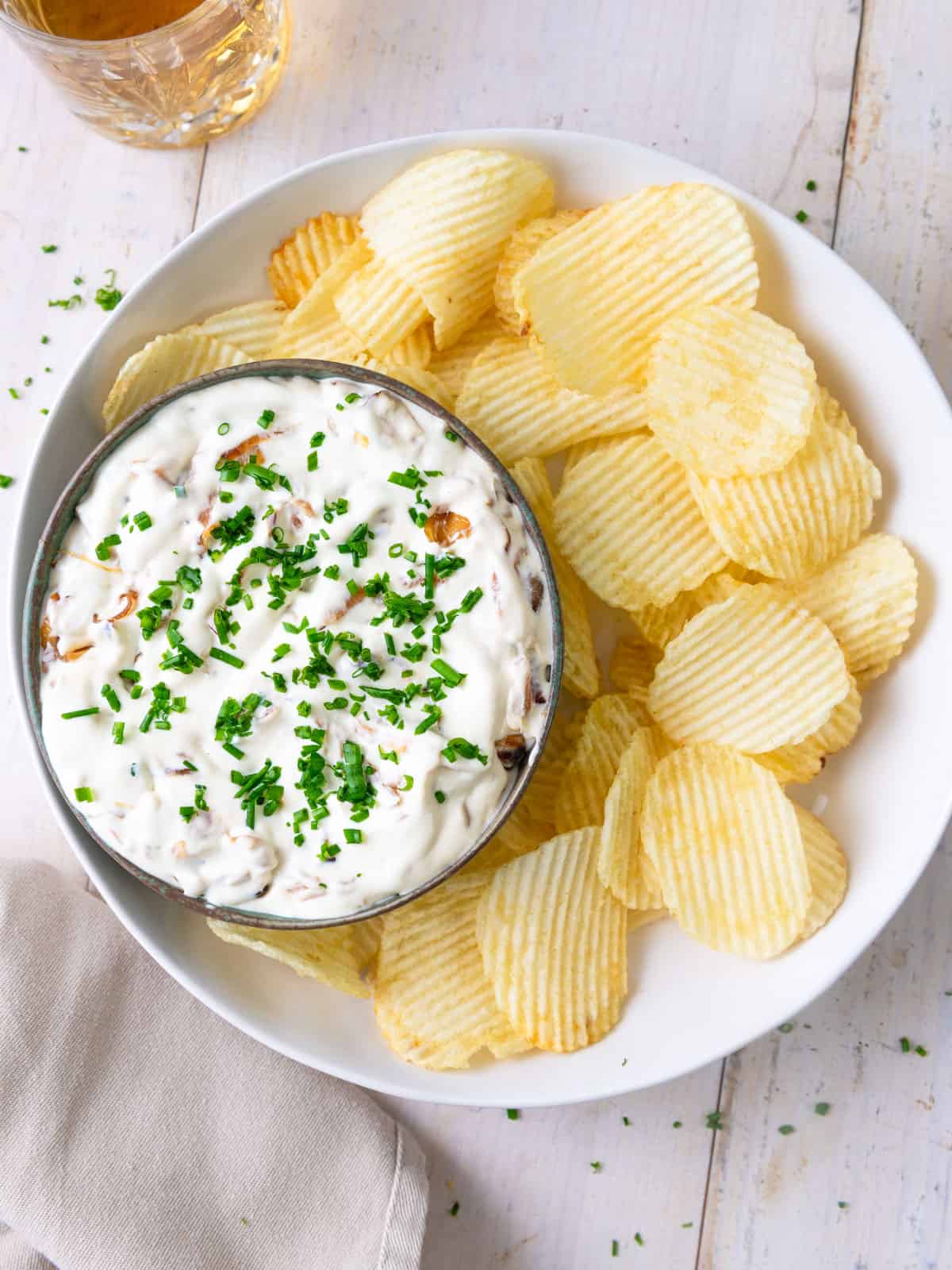 Creamy caramelized onion dip with potato chips.