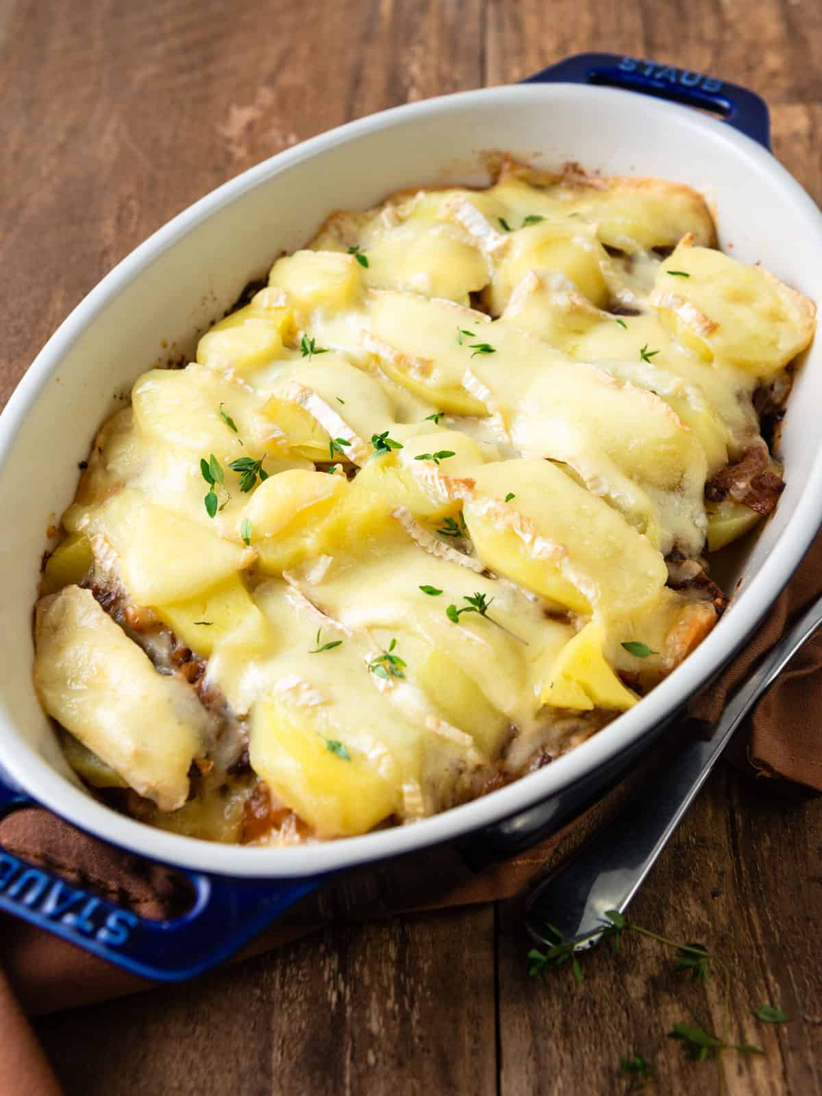 French potato and onion casserole with bacon and brie cheese.