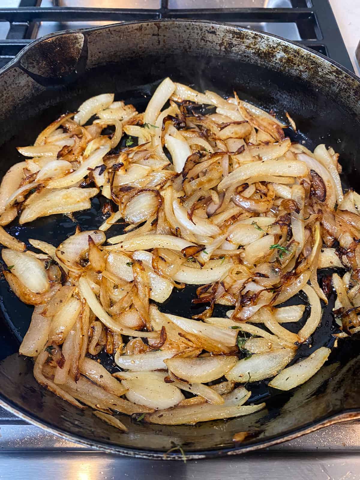 Saute the sliced onions until the begin to caramelize.