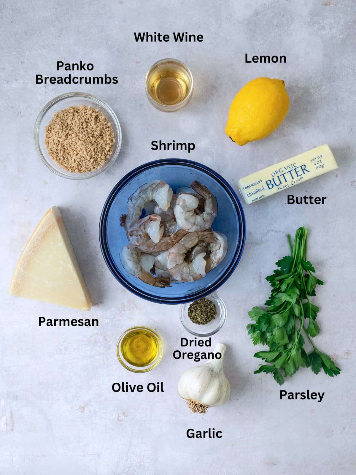 Ingredients for shrimp oreganata, including white wine, Parmesan cheese, dried oregano and garlic.