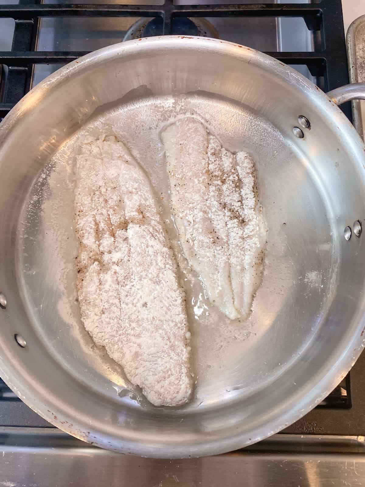 Dredge the sole fillets in flour and sear in clarified butter.