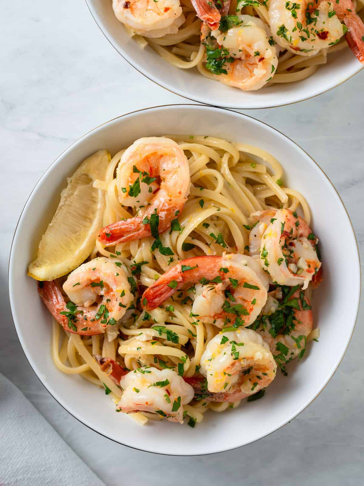 White wine shrimp scampi pasta with Parmesan cheese.