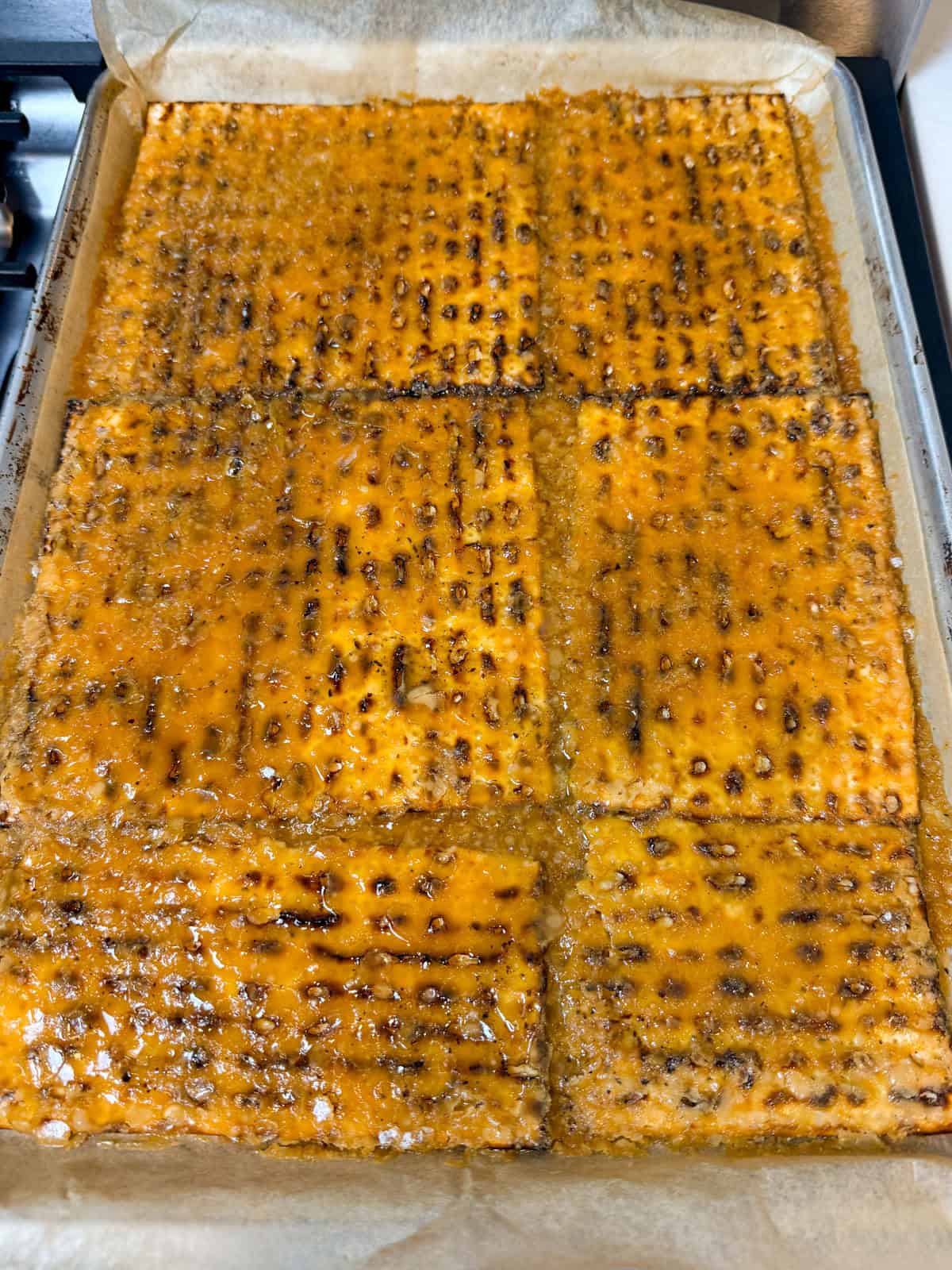 Bake the matzo toffee until toffee begins to thicken on the matzo.