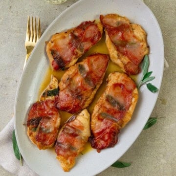 Chicken saltimbocca with sage, Parmesan and white wine sauce.