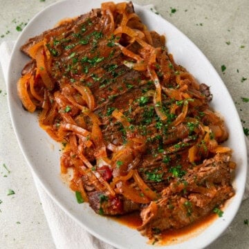 Red wine slow cooker brisket with onions.