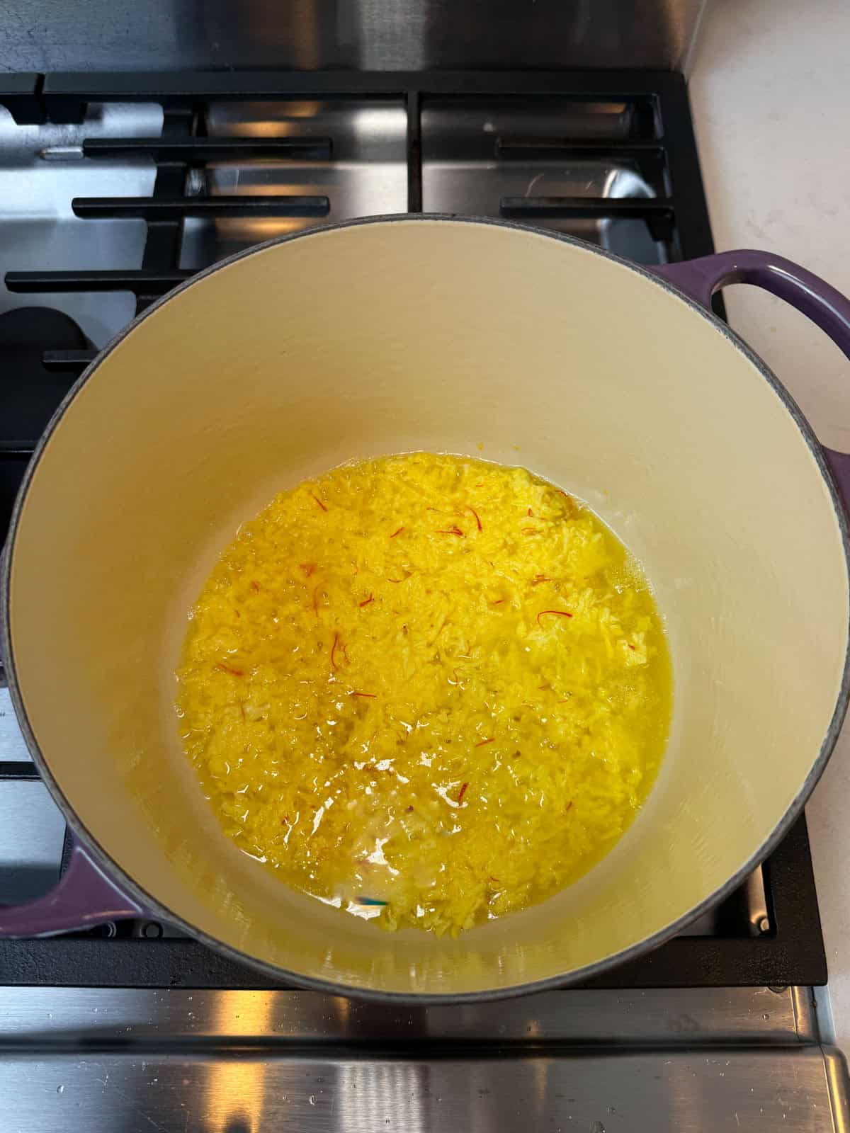 Layer the saffron rice yogurt layer on the bottom of the pot, this will be the tahdig layer.