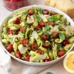 This pesto caprese pasta salad with full of cherry tomatoes, Parmesan cheese and a vibrant fresh pesto.