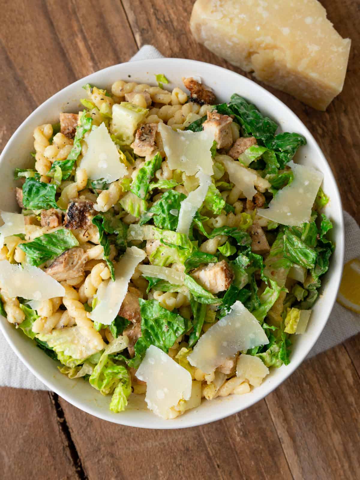 Assemble the Caesar pasta salad and toss with homemade dressing. 
