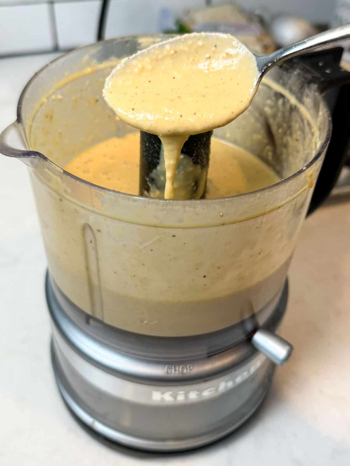 Blend the Caesar dressing until emulsified and the dressing easily coats a spoon.
