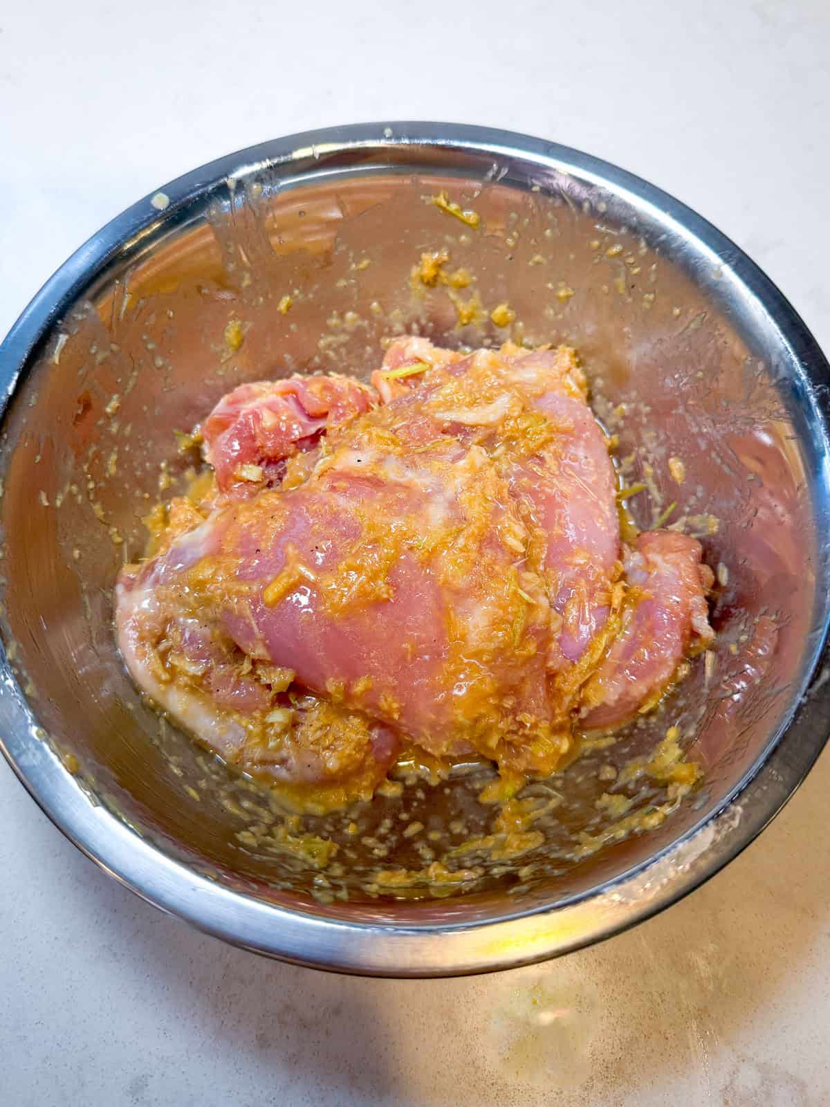 Marinate the chicken thighs in the lemongrass, ginger and garlic mixture.