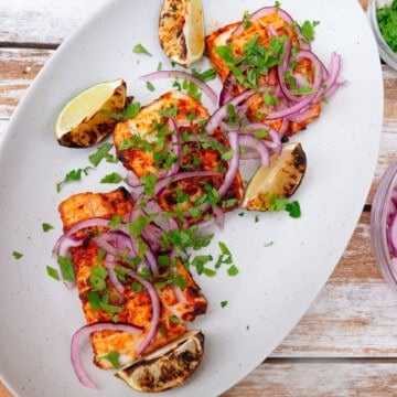 Zarandeado fish is flavored with guajillo chili, garlic, onion and mayo and grilled until just cooked through.