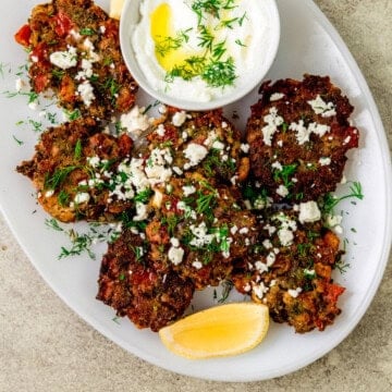 Greek tomato fritters are savory pancakes that are full of sweet tomatoes, fresh mint, dill and creamy feta cheese.