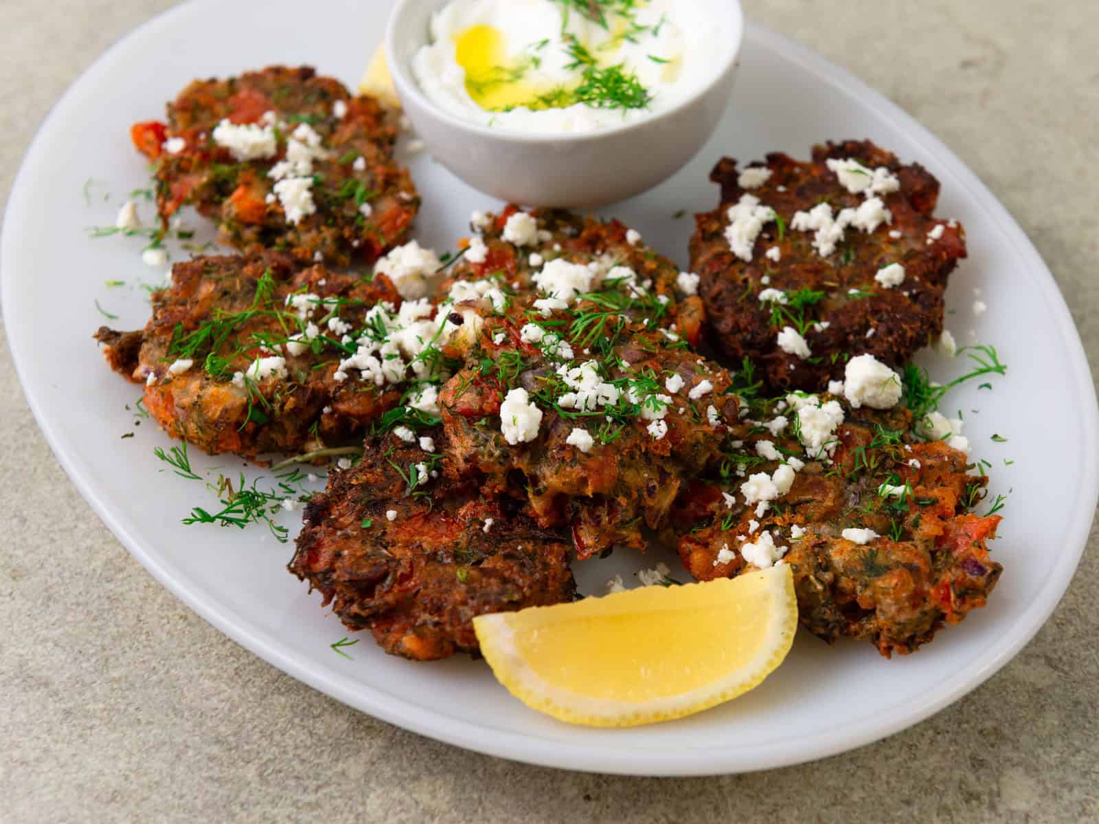 Greek tomato fritters with feta, herbs and lemon.