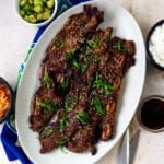 Grilled Korean short ribs with rice and kimchi.