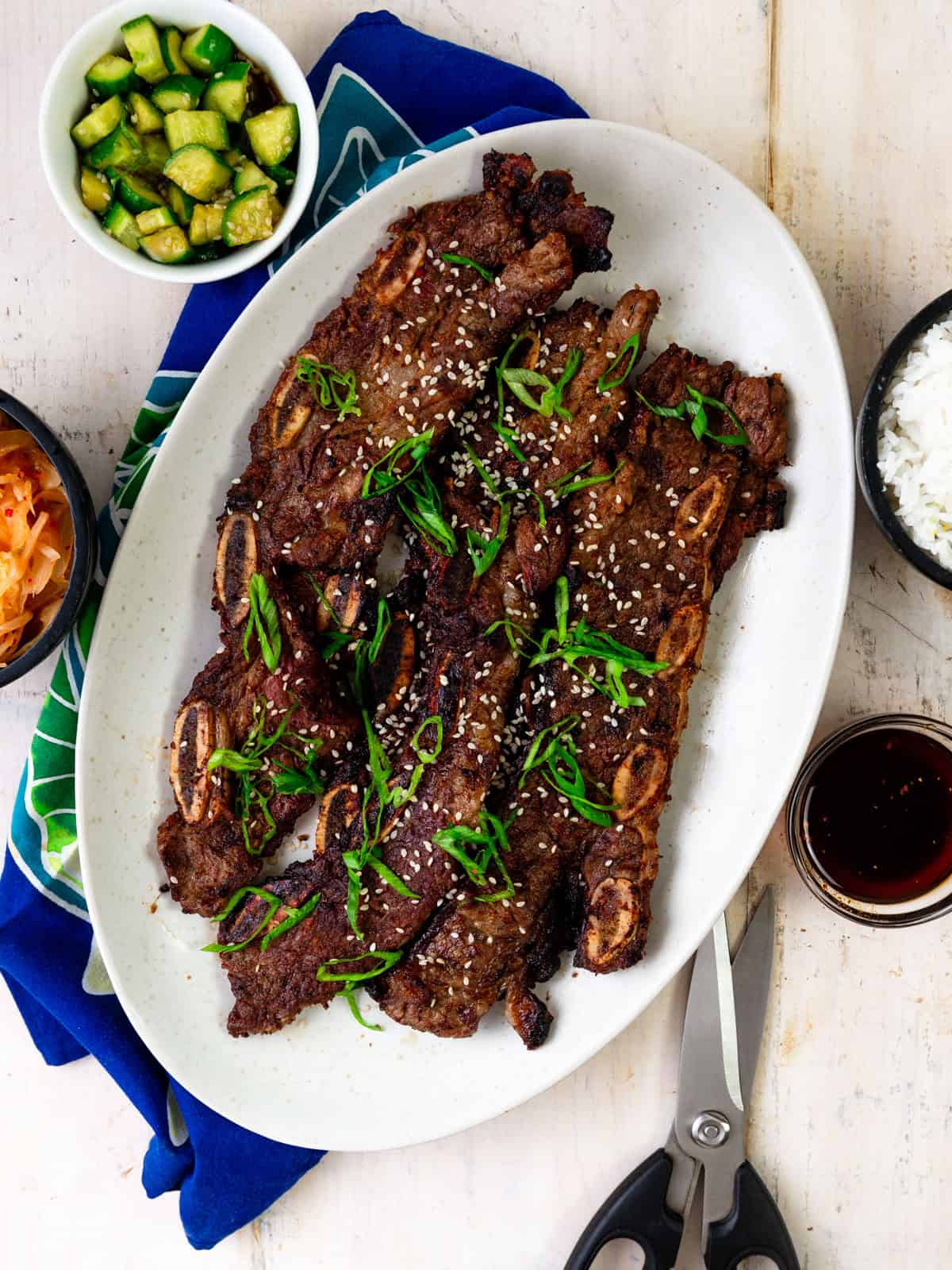 Serve the grilled Korean short ribs with kimchi and rice.