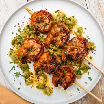 Grilled shrimp skewers with olives and preserved lemon.