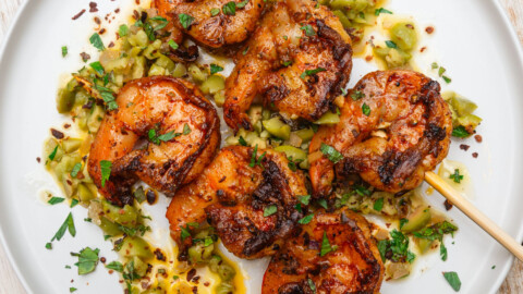 Grilled shrimp skewers with olives and preserved lemon.
