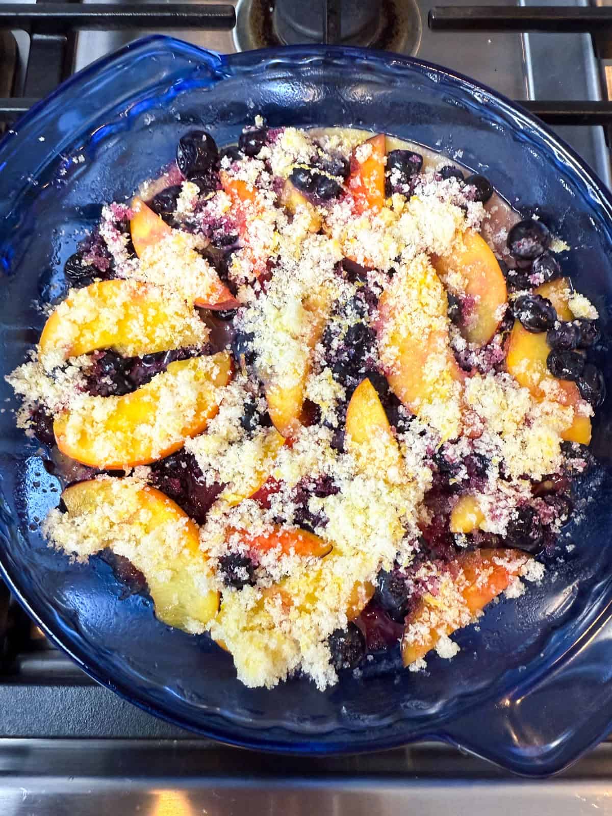 Sprinkle lemon sugar on top of the fruit layer.