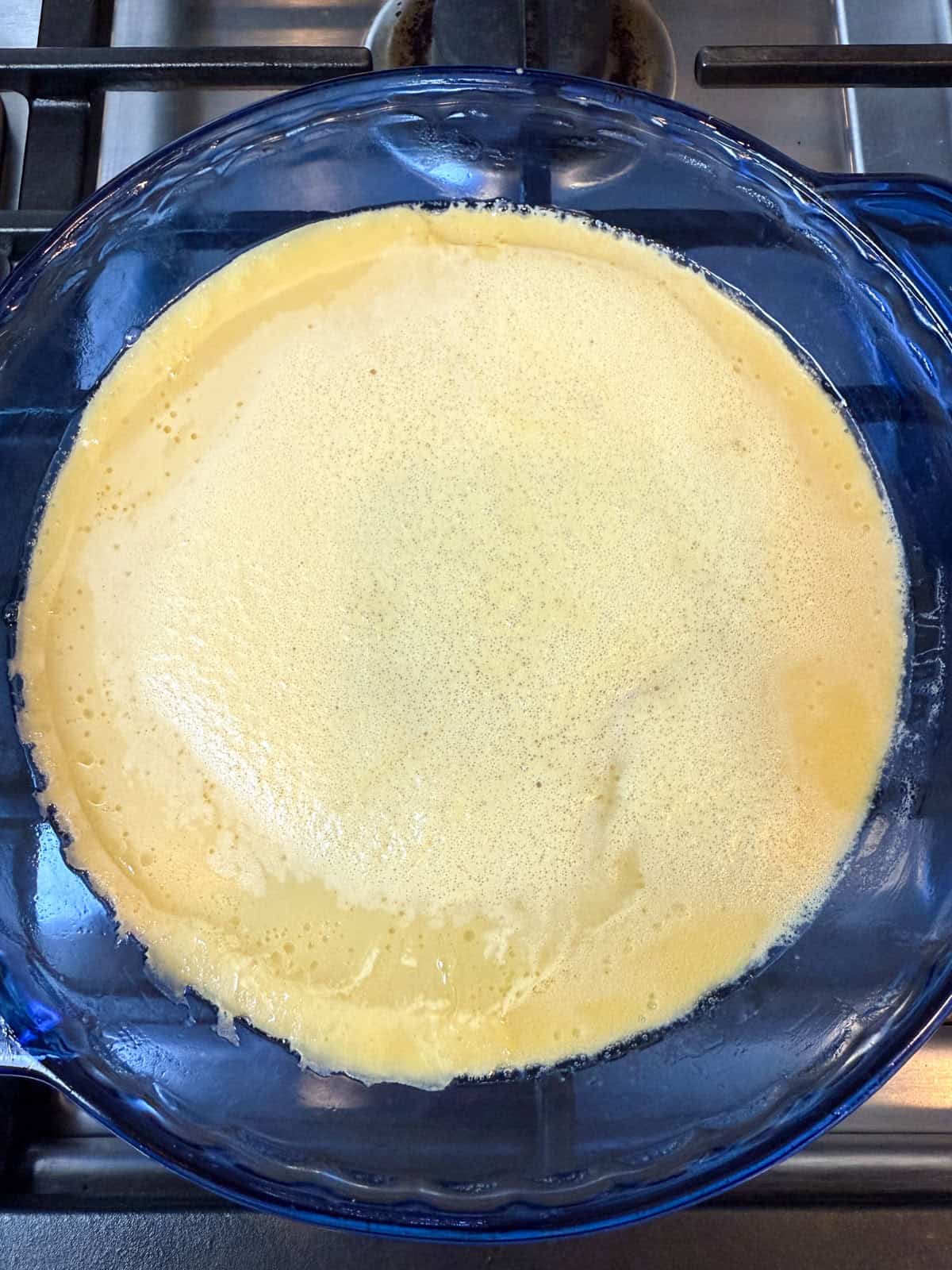 Par bake half of the clafoutis batter before layering on the fresh fruit.