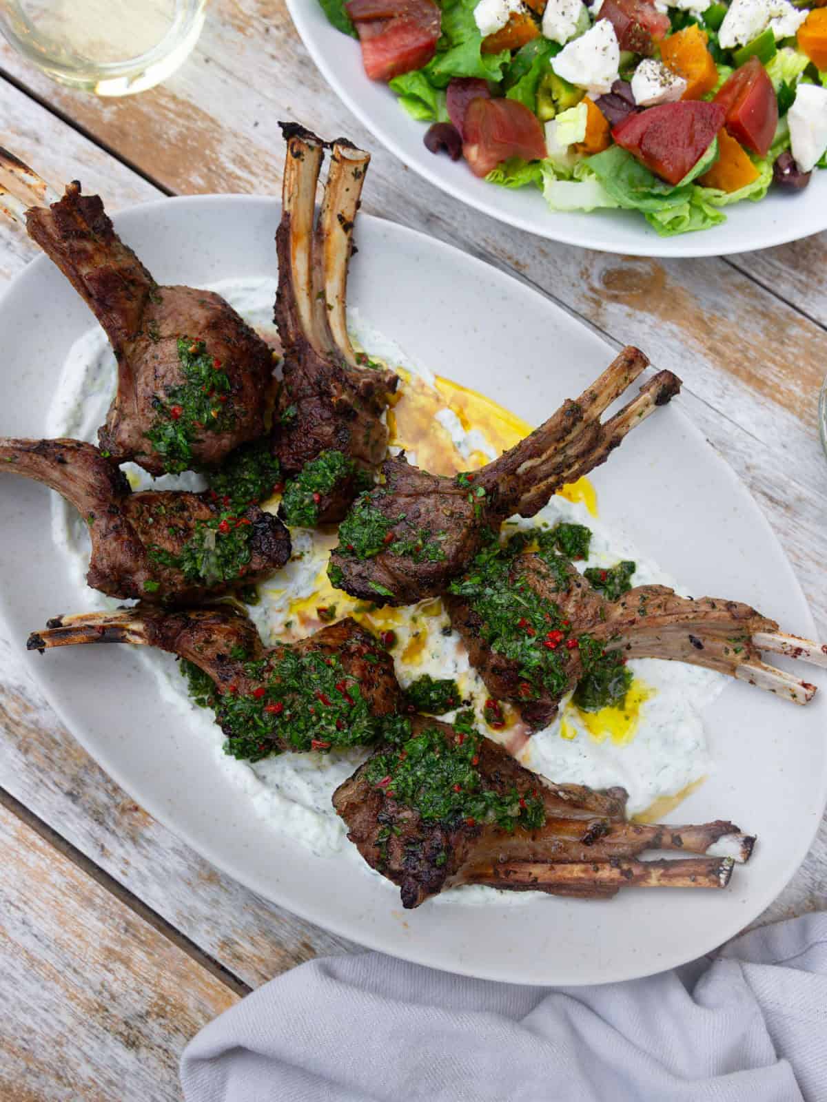 Serve the grilled lamb chops with reserved chimichurri on top.