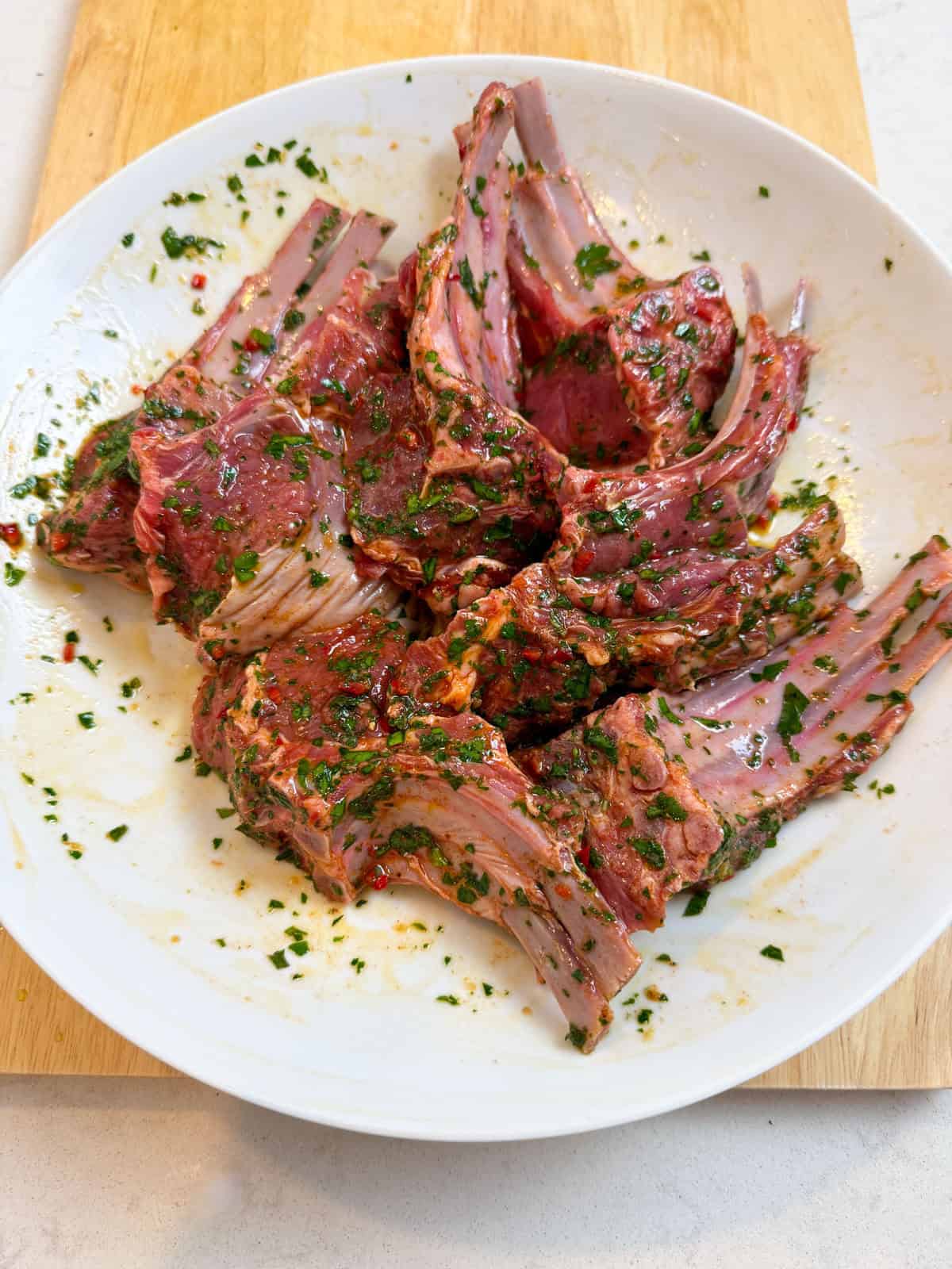 Add a few tablespoons of the chimichurri sauce to the lamb chops with a dash of paprika and rub all over the lamb chops.
