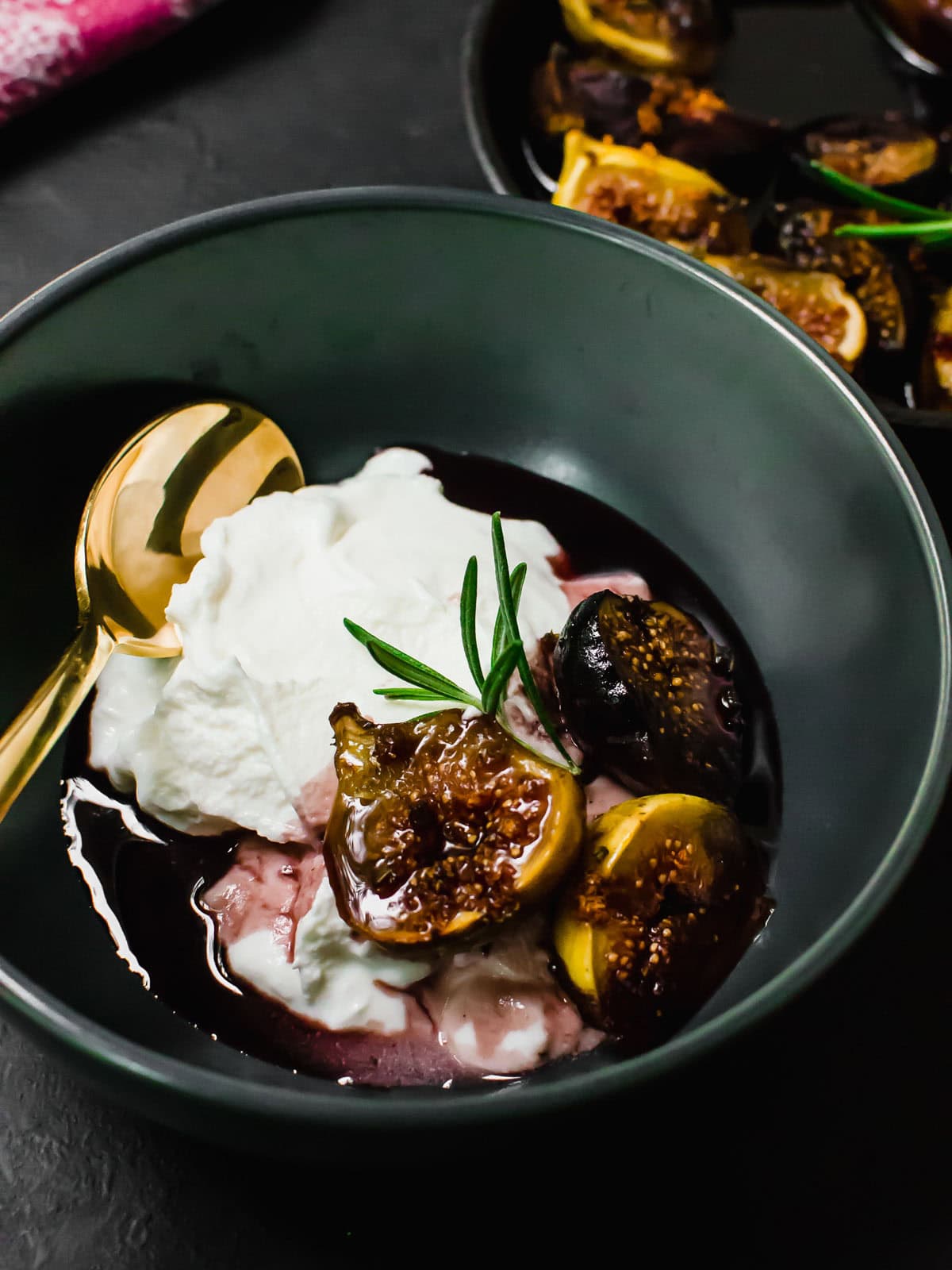 Serve wine roasted figs with creamy yogurt and spoon the syrupy wine sauce around.