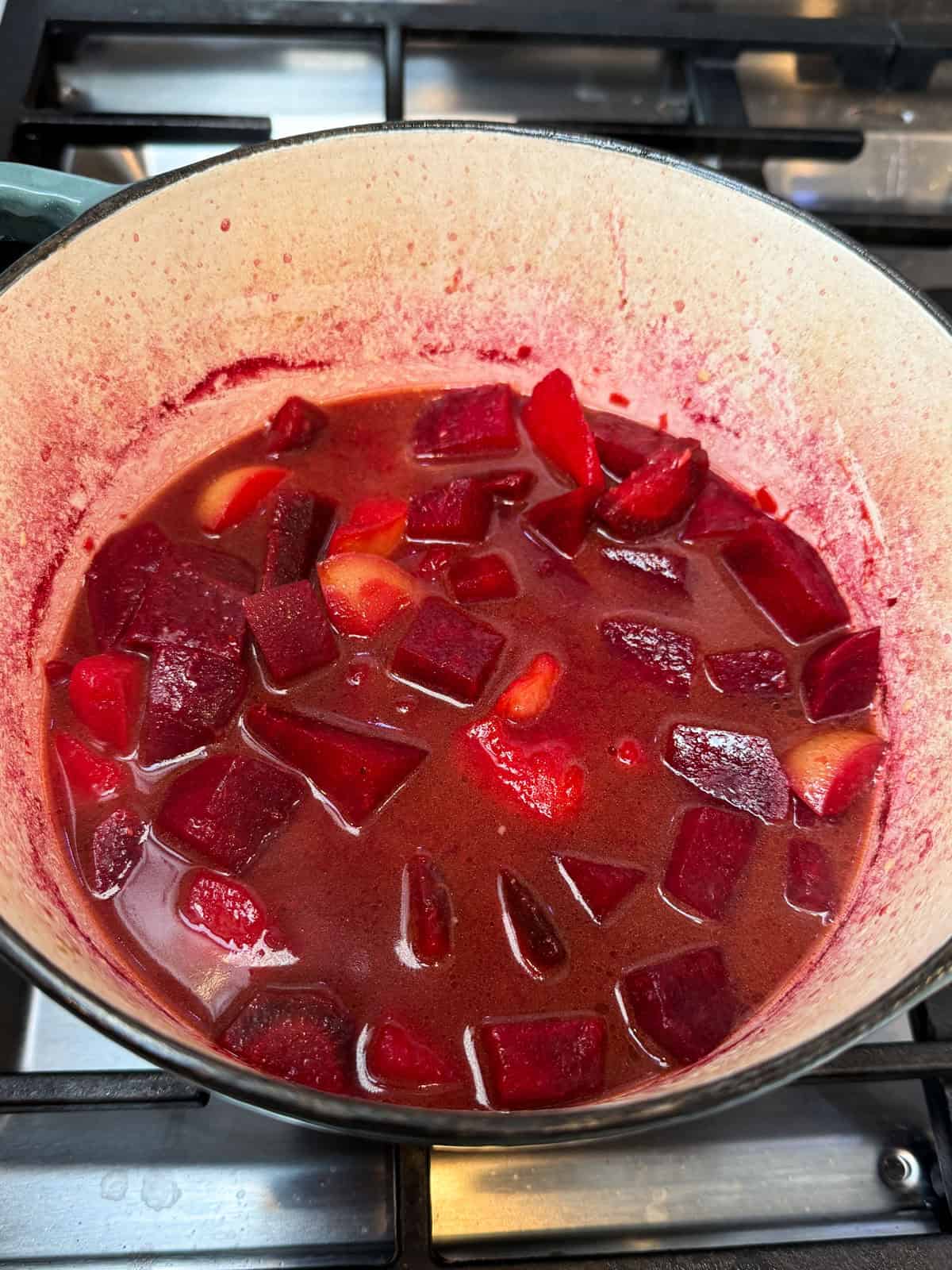 Cook the beet soup until the beets and potatoes are fork tender.