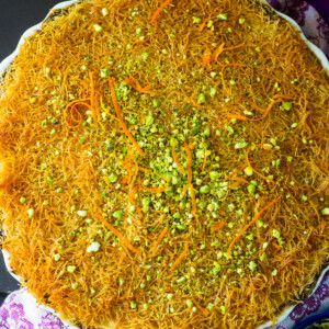 Kanafe is shredded phyllo with melty cheese in the center and soaked in simple syrup.