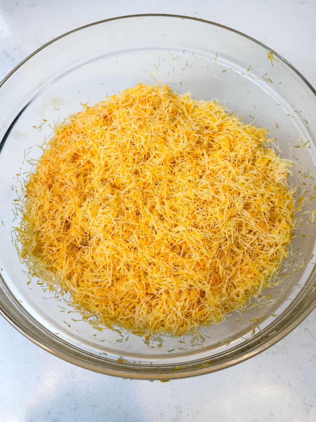 Mix the melter butter with the shredded phyllo, making sure every strand is coated evenly.