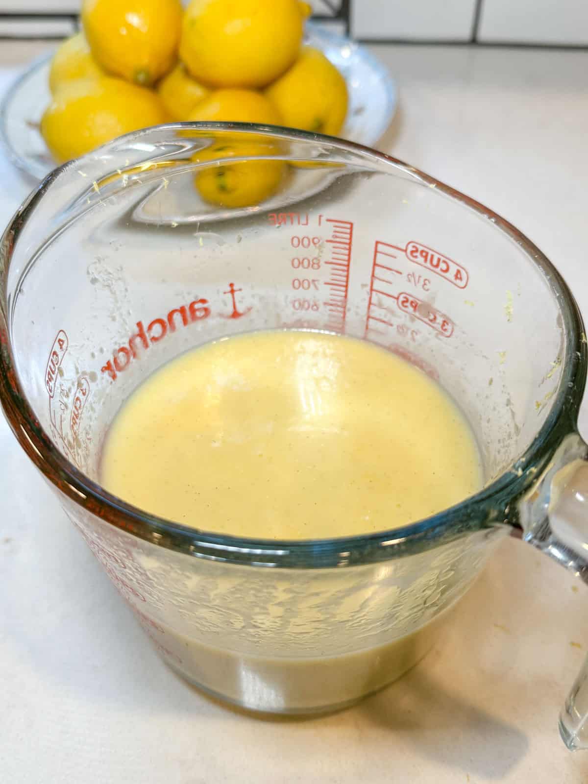 whisk together the wet ingredients for the lemon olive oil cake.