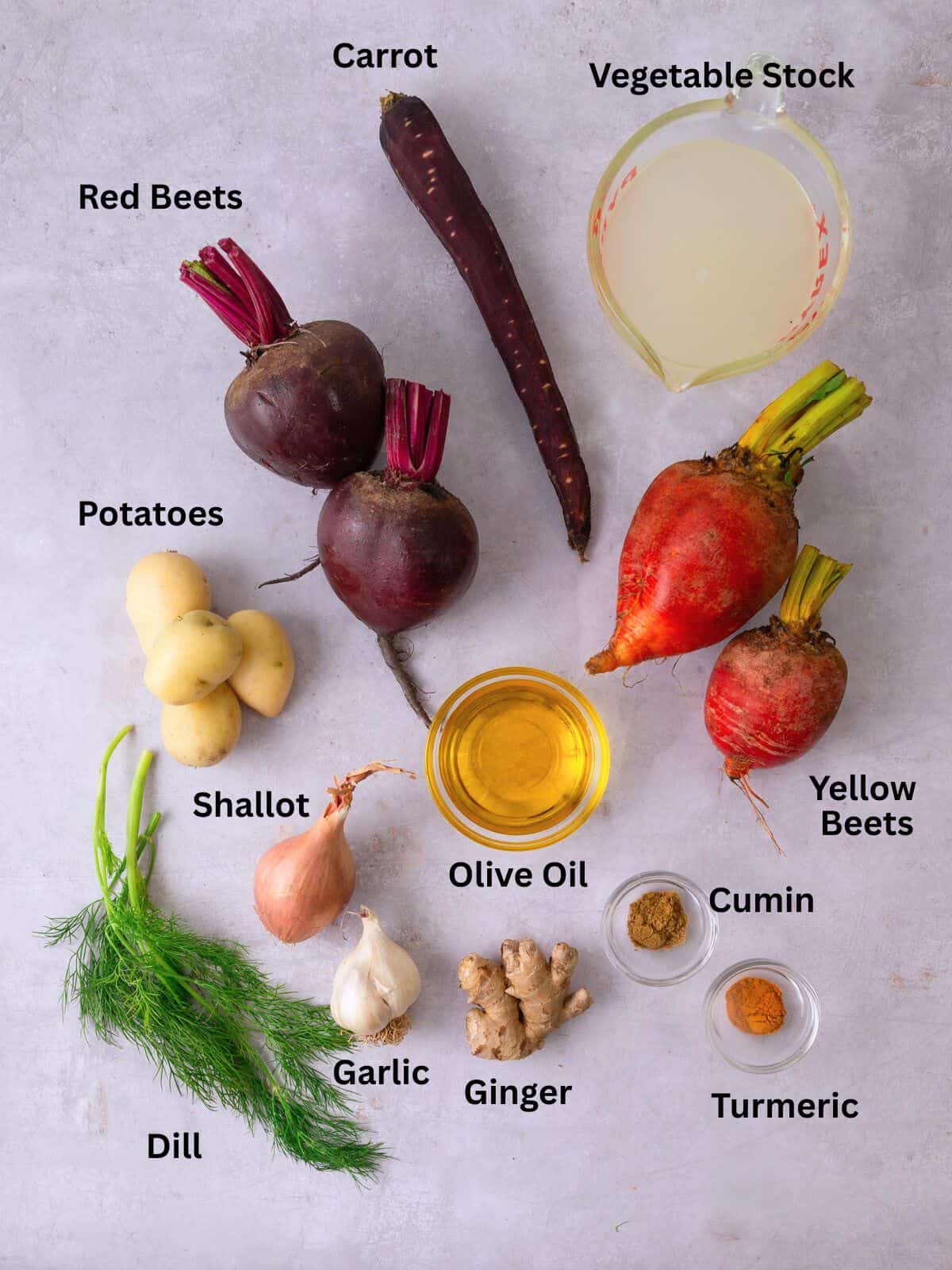 Ingredients for beet soup including potatoes, shallots, vegetable stock and fresh dill.