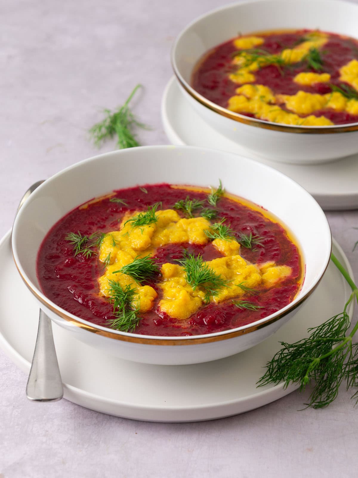 Vegetarian beet soup with red and yellow beets.