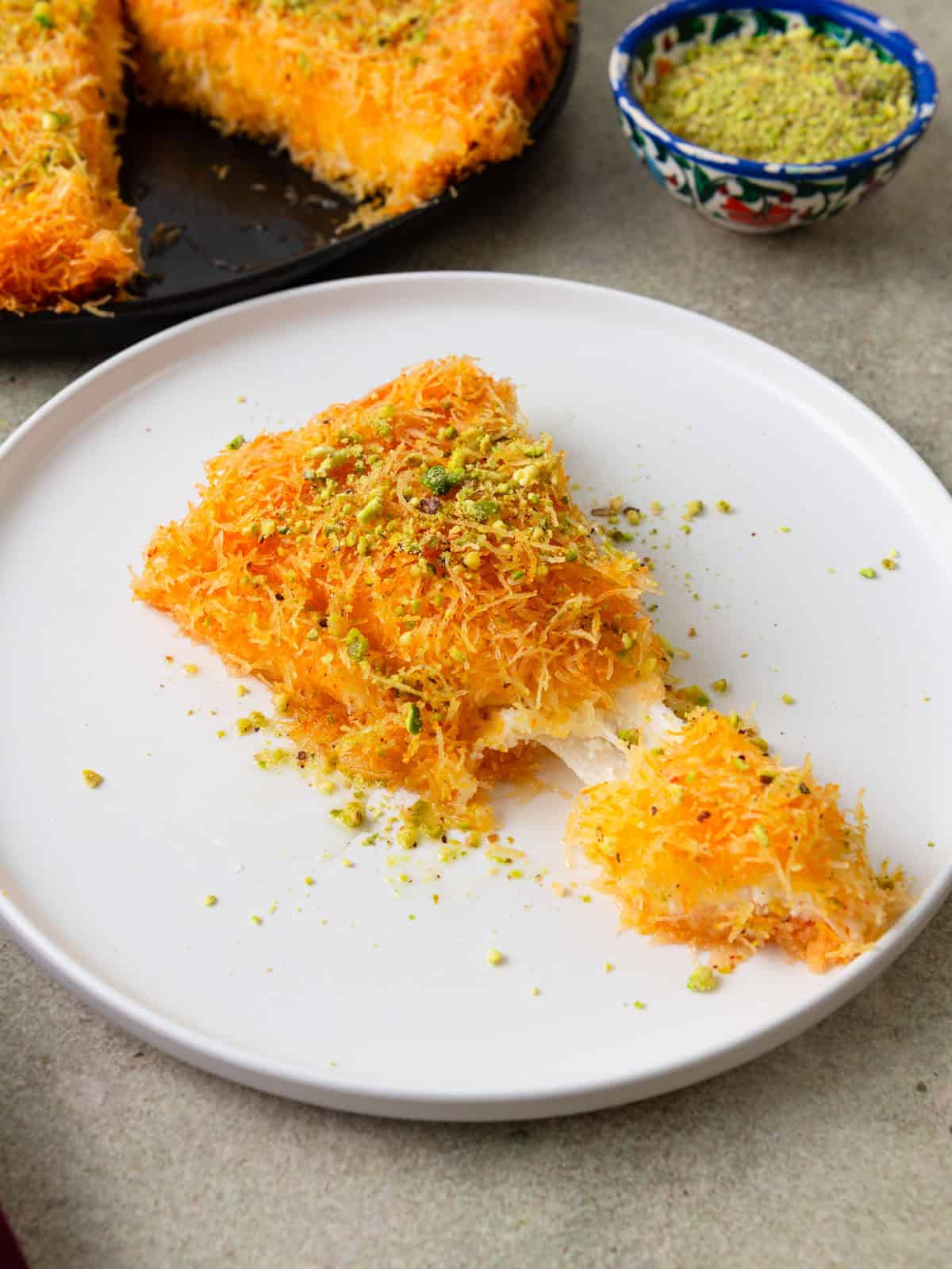 Sliced kanafe with cheese in the center.