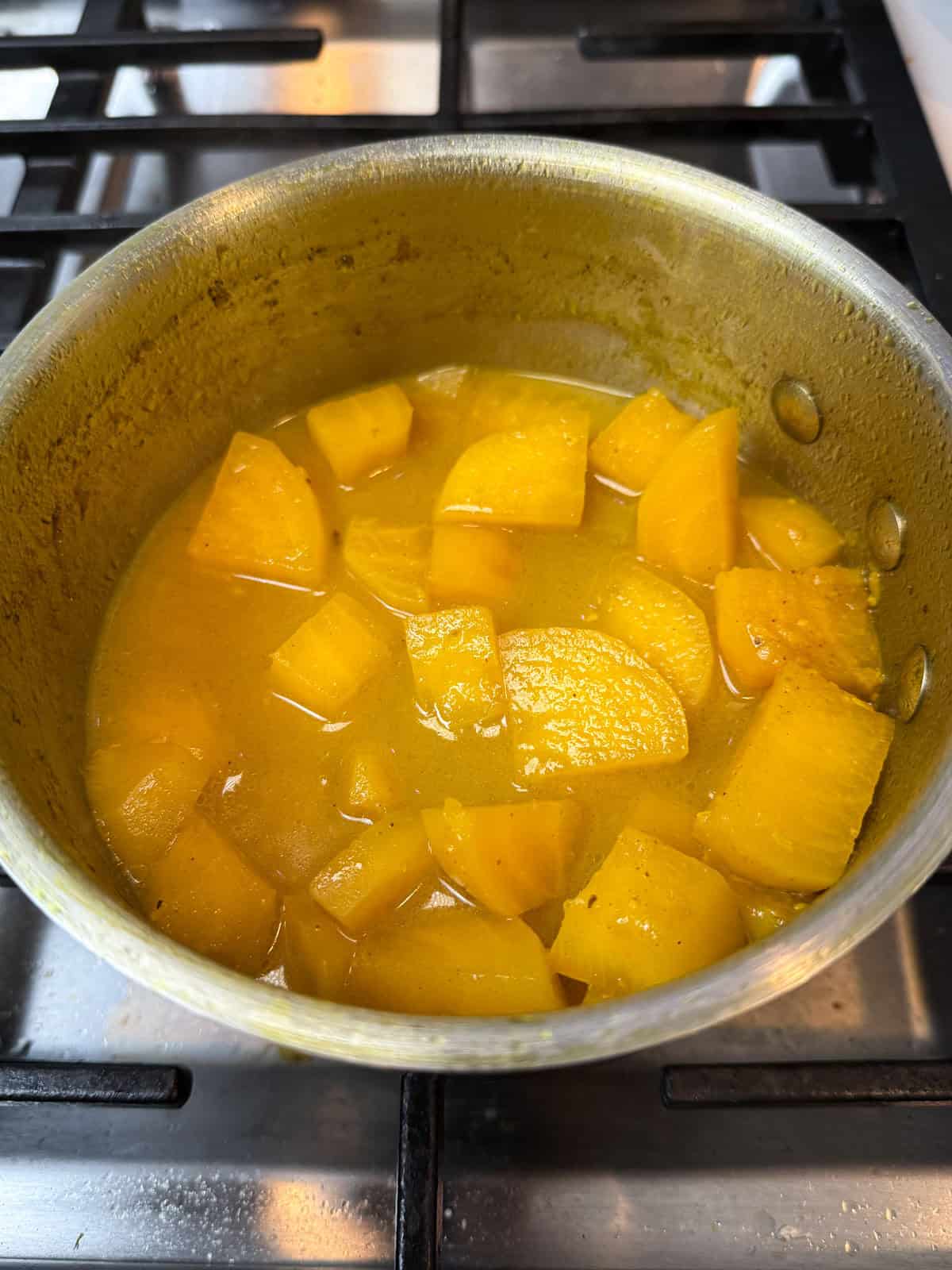 Cook the yellow beet soup until the beets are fork tender.