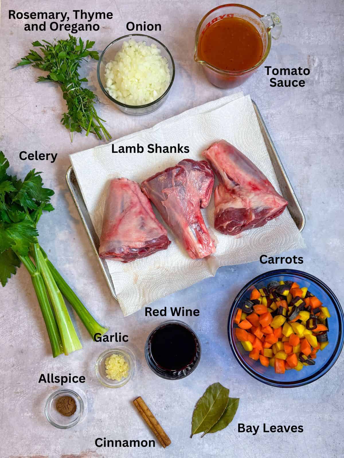 Ingredients for braised Greek lamb shanks with vegetables, cinnamon, allspice and fresh herbs.