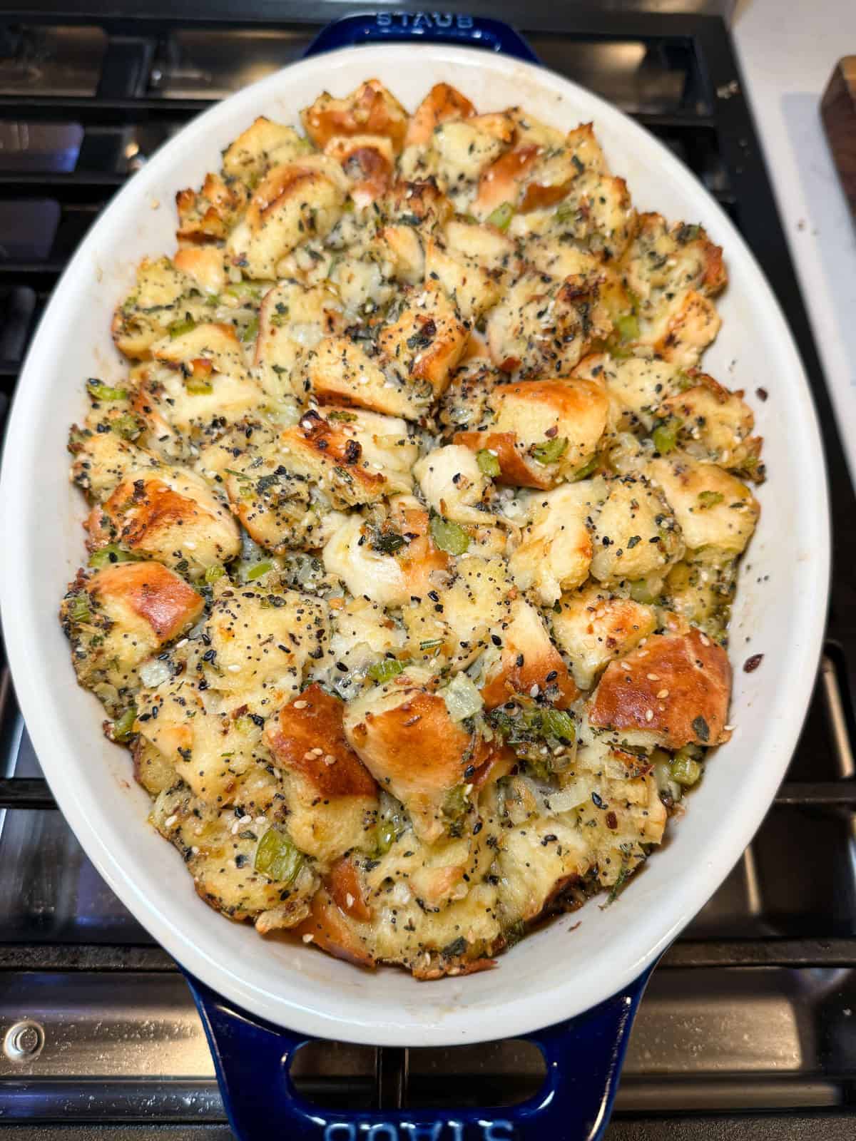 Bake the everything spiced bagel stuffing until lightly golden on top.