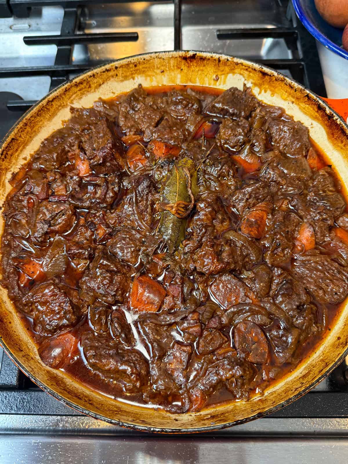 After about 2 hours, the beef should be fork-tender and the sauce thickened. Skim off any excess fat on top if needed.