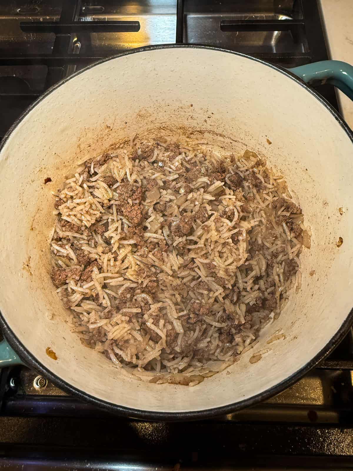 Cook the hashweh mixture until basmati rice is cooked through.