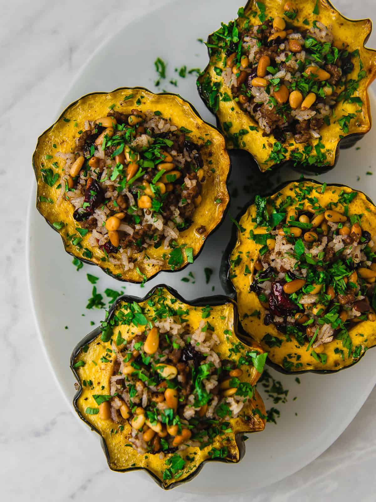 Stuffed acorn squash with Hashweh, a Middle Eastern spiced rice mixture.