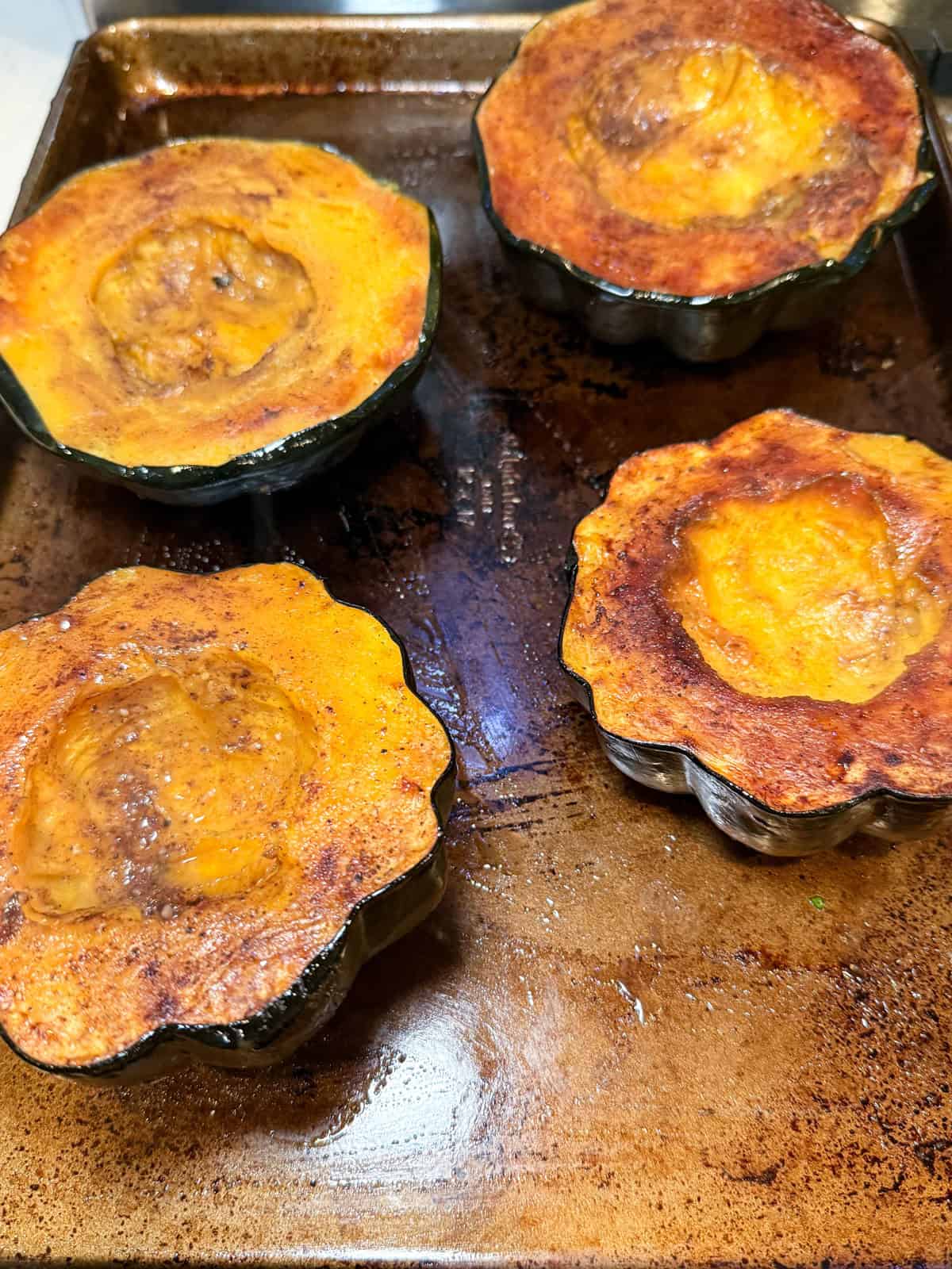 Roast the acorn squash until halfway cooked, before adding the rice filling.