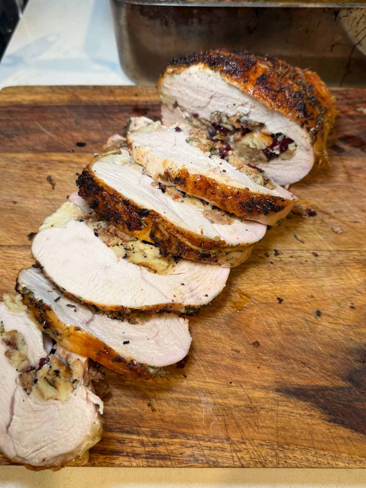 Once done, let the rolled turkey breast rest for a few minuets before slicing.