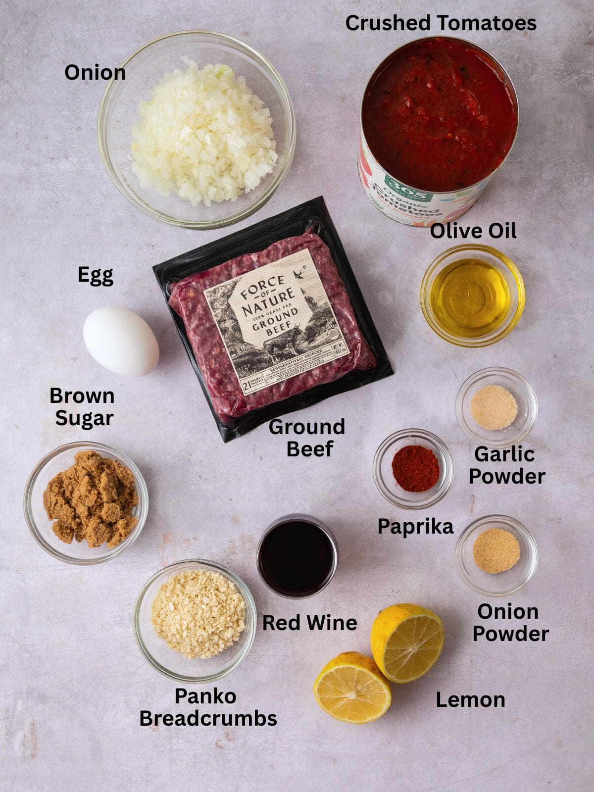 Ingredients for Jewish style sweet and sour meatballs including crushed tomatoes, ground beef, brown sugar, red wine and spices.