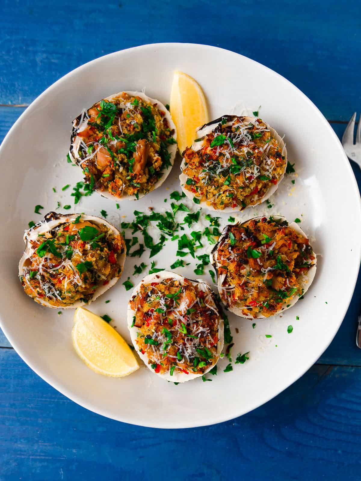Stuffed clams casino with parmesan cheese and fresh herbs.