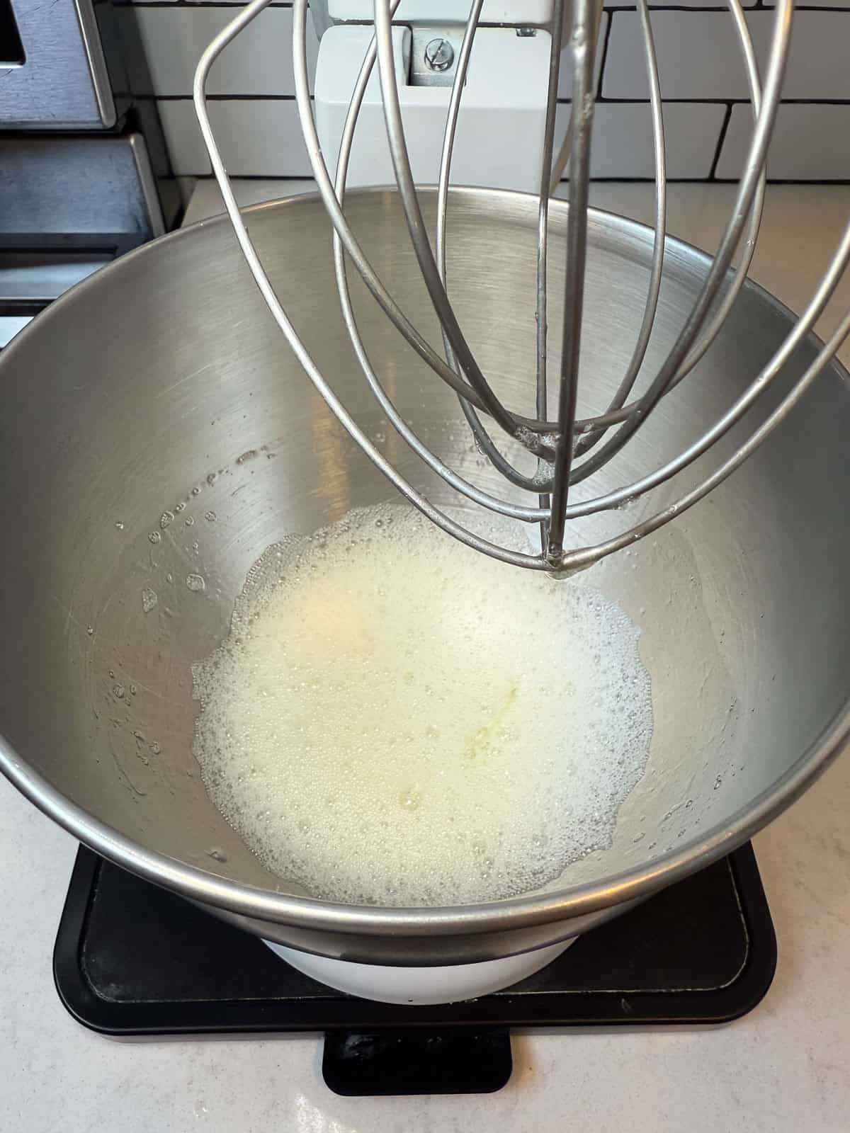 At the beginning stage of whipping egg whites, they will start to break up and become frothy.