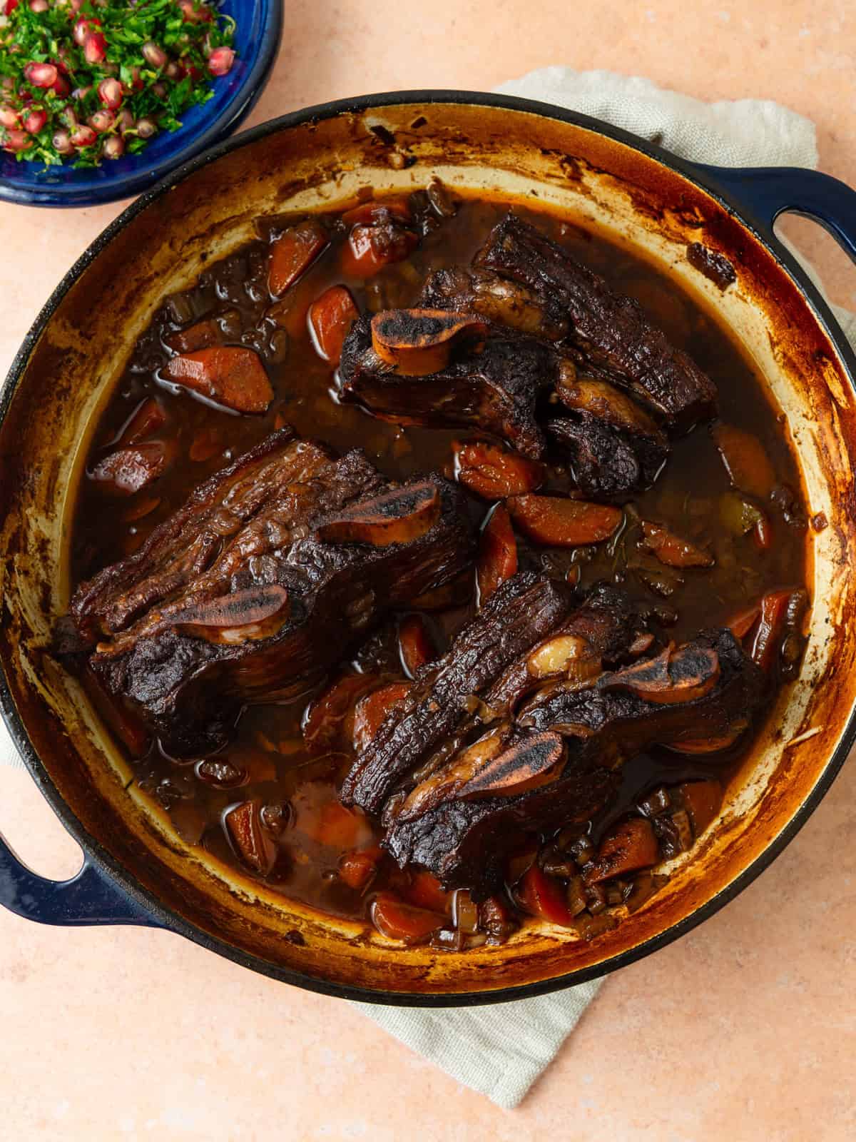 Braised pomegranate short ribs in a rich red wine and pomegranate sauce.