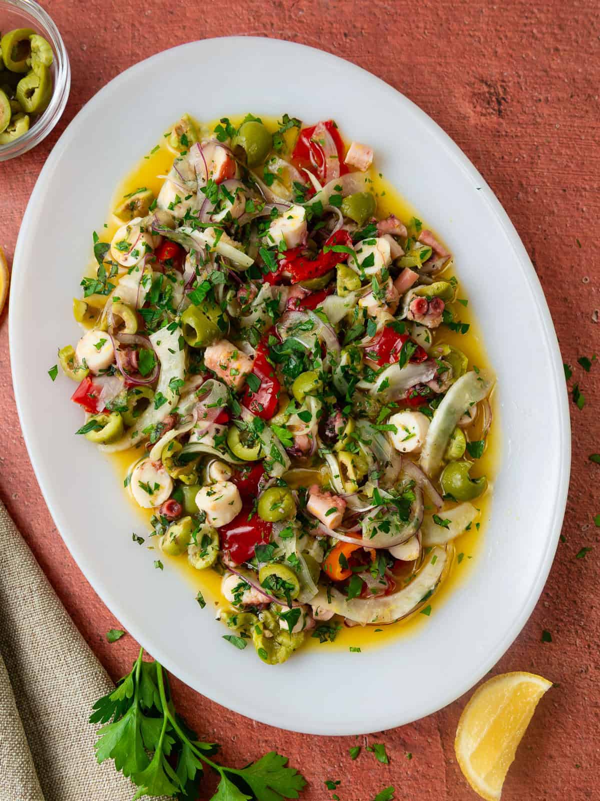 This chilled octopus salad is full of bright Mediterranean flavors with olives, fennel, bright lemon and spicy pickled peppers.
