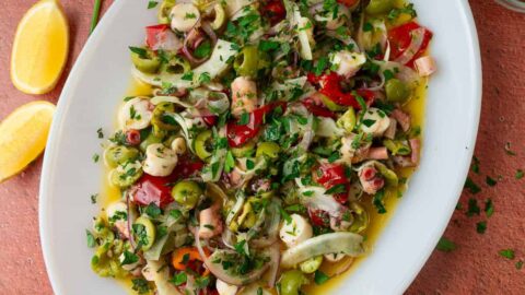 Mediterranean octopus salad with olives in a lemon vinaigrette.