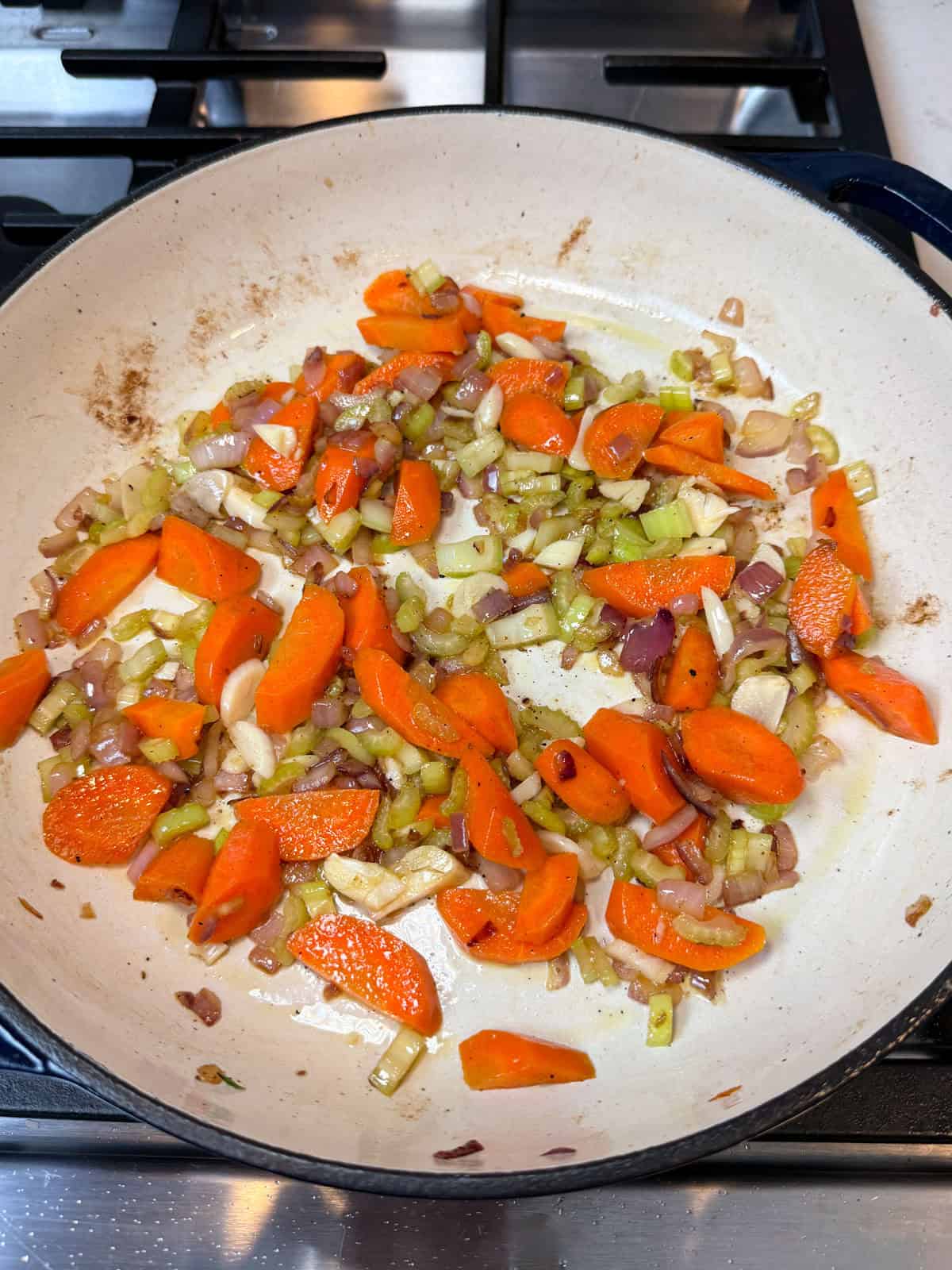 Remove the seared short ribs from the Dutch oven and saute the chopped vegetables.