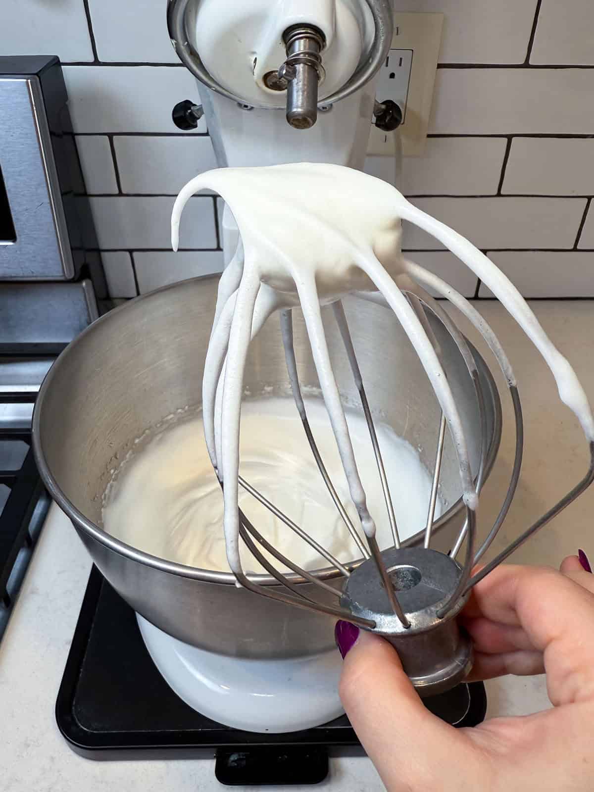 Whip the egg whites until medium-hard peaks.