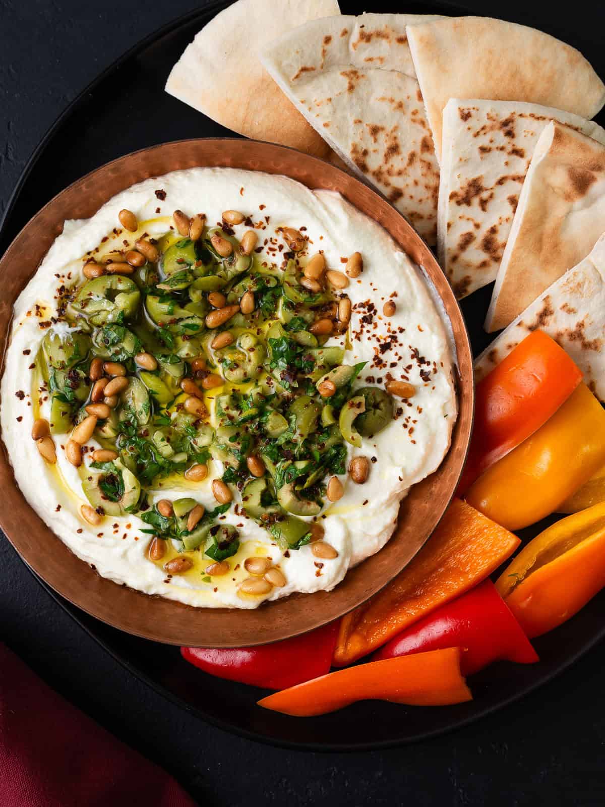 Whipped feta made with honey and yogurt and topped with marinated olives.